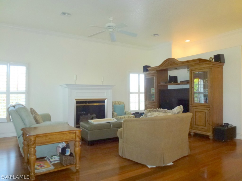 11920 Shawnee Road Fort Myers, FL 33913 - Photo 13 of 25 a living room with furniture and a fireplace