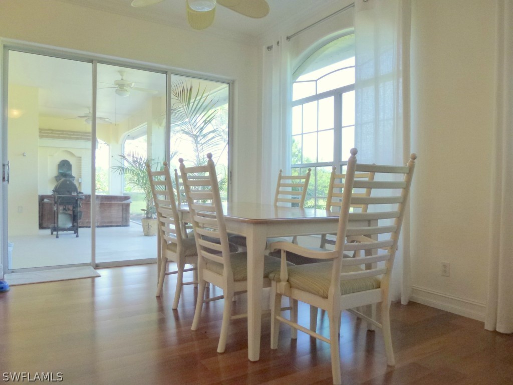 11920 Shawnee Road Fort Myers, FL 33913 - Photo 14 of 25 a dining room with furniture window wooden floor