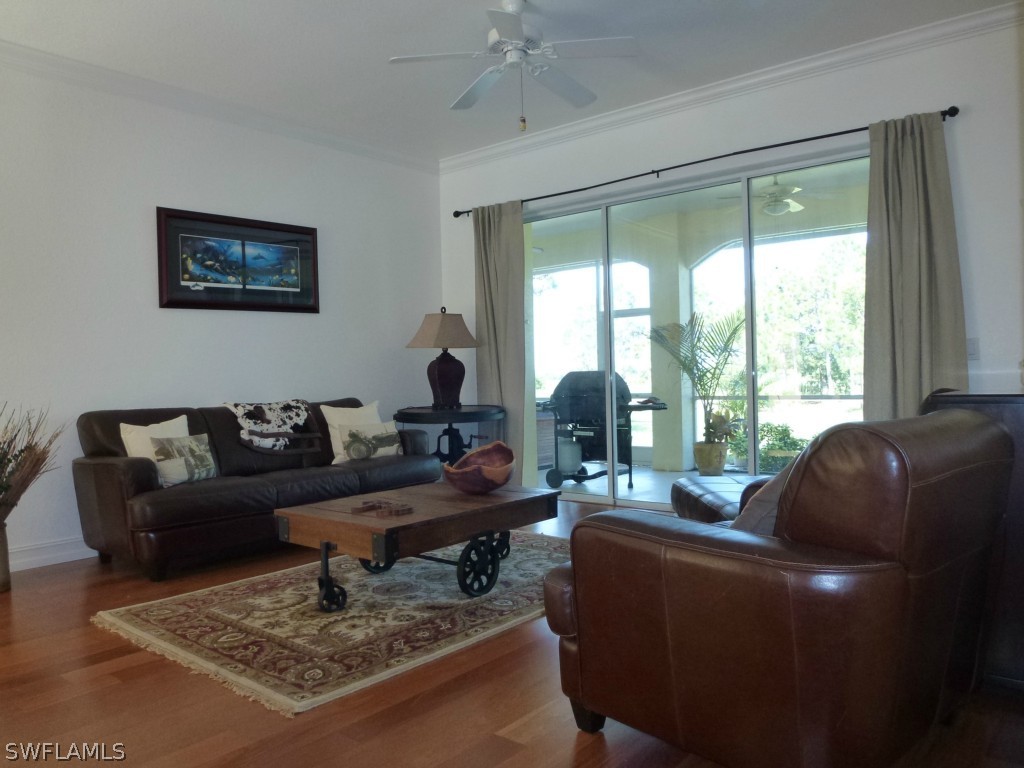 11920 Shawnee Road Fort Myers, FL 33913 - Photo 15 of 25 a living room with furniture and a large window