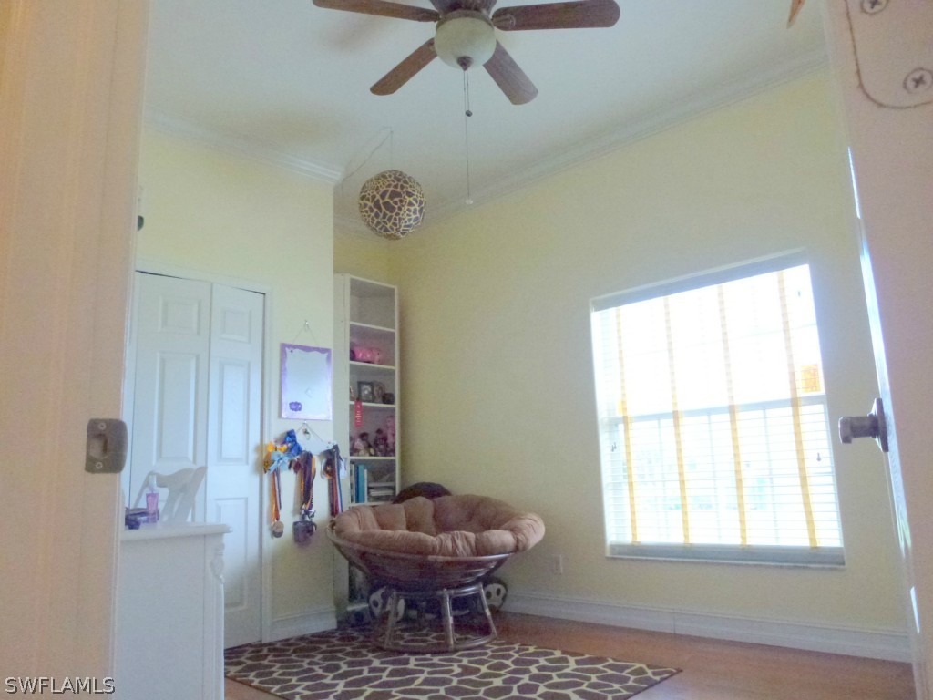11920 Shawnee Road Fort Myers, FL 33913 - Photo 17 of 25 a living room with a couch and a window
