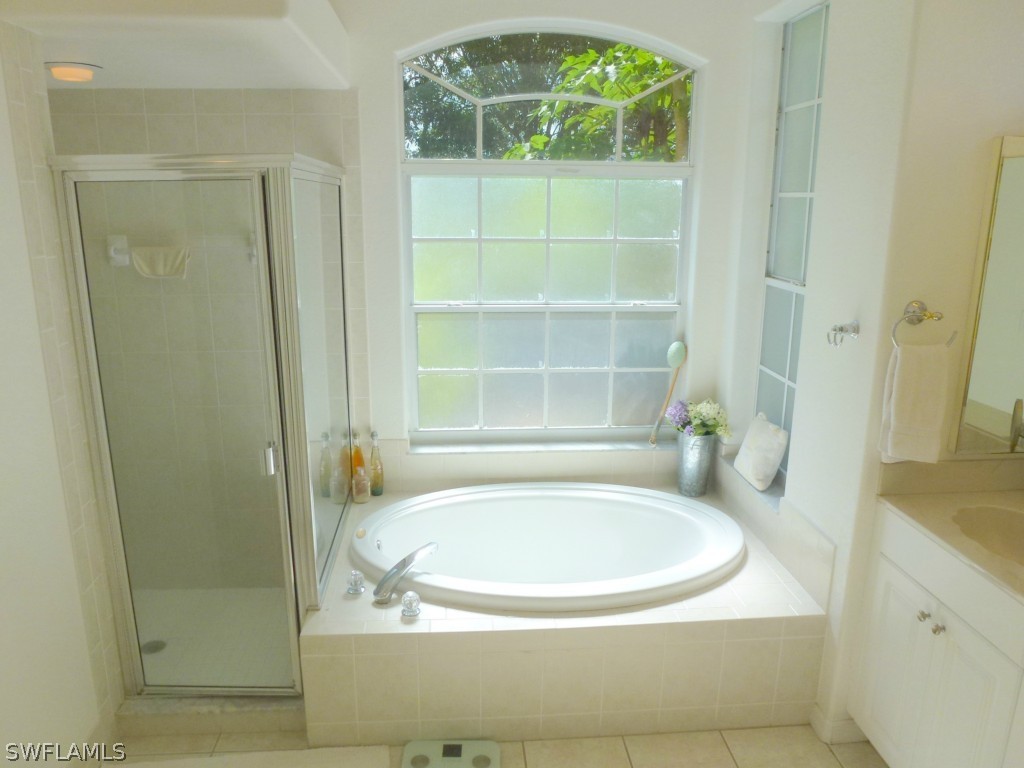 11920 Shawnee Road Fort Myers, FL 33913 - Photo 21 of 25 a bathroom with a sink and a mirror