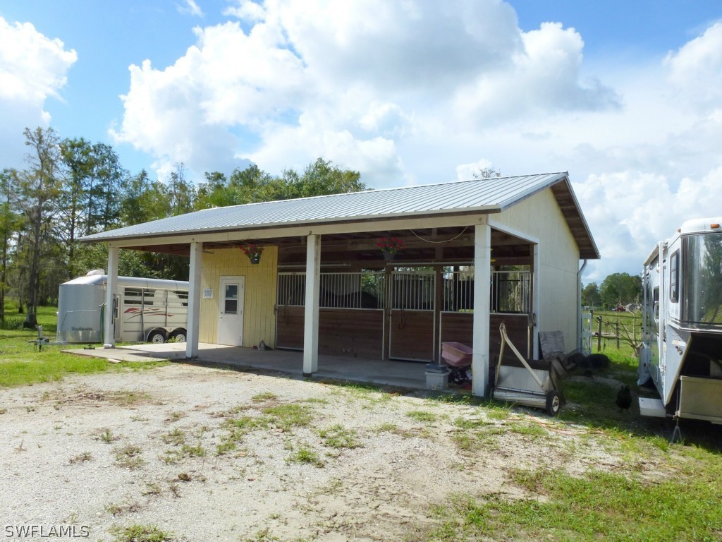 11920 Shawnee Road Fort Myers, FL 33913 - Photo 8 of 25 a view of a house with a backyard
