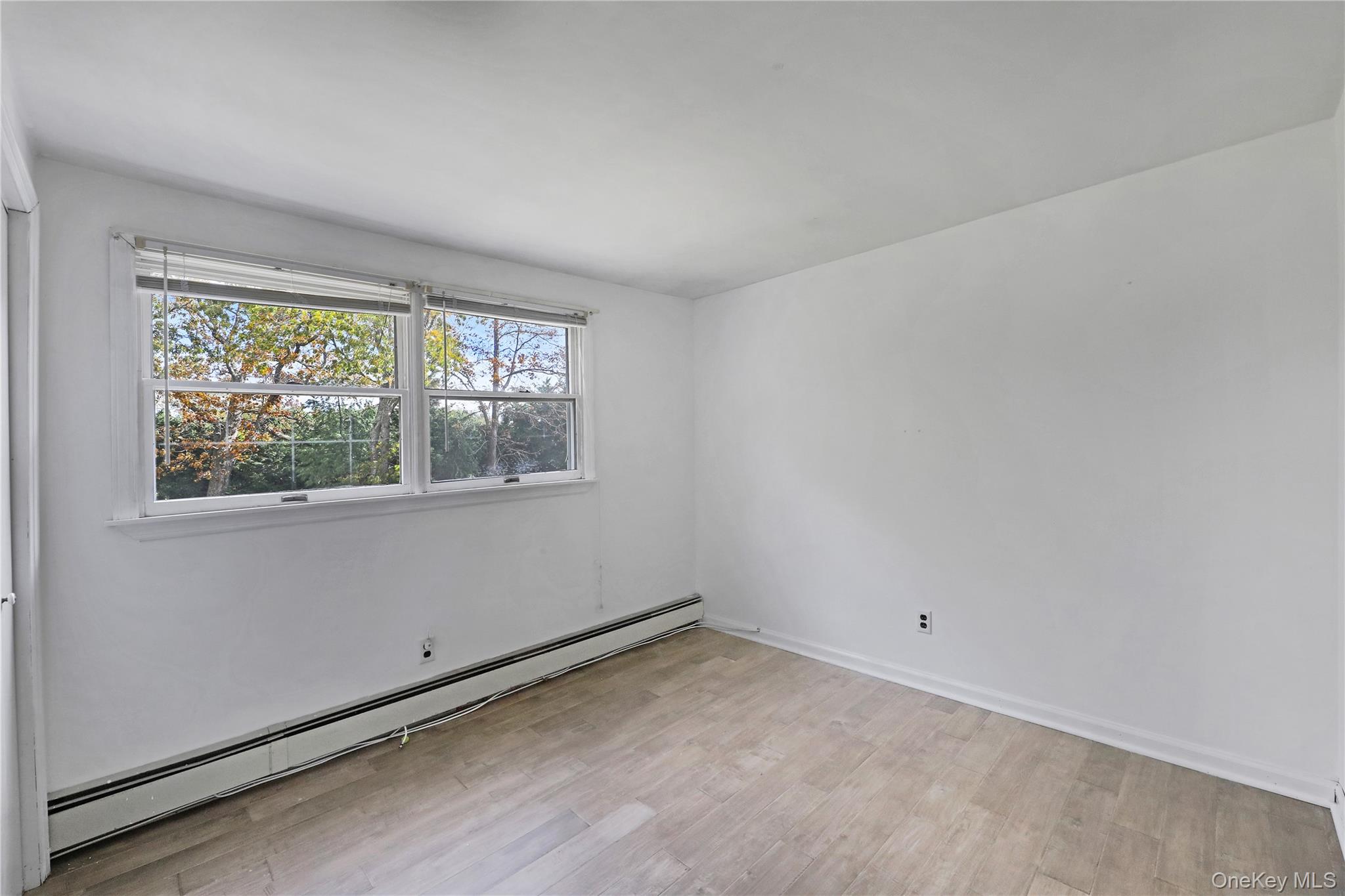 48 Nidzyn Avenue Remsenburg, NY 11960 - Photo 28 of 43 an empty room with a window