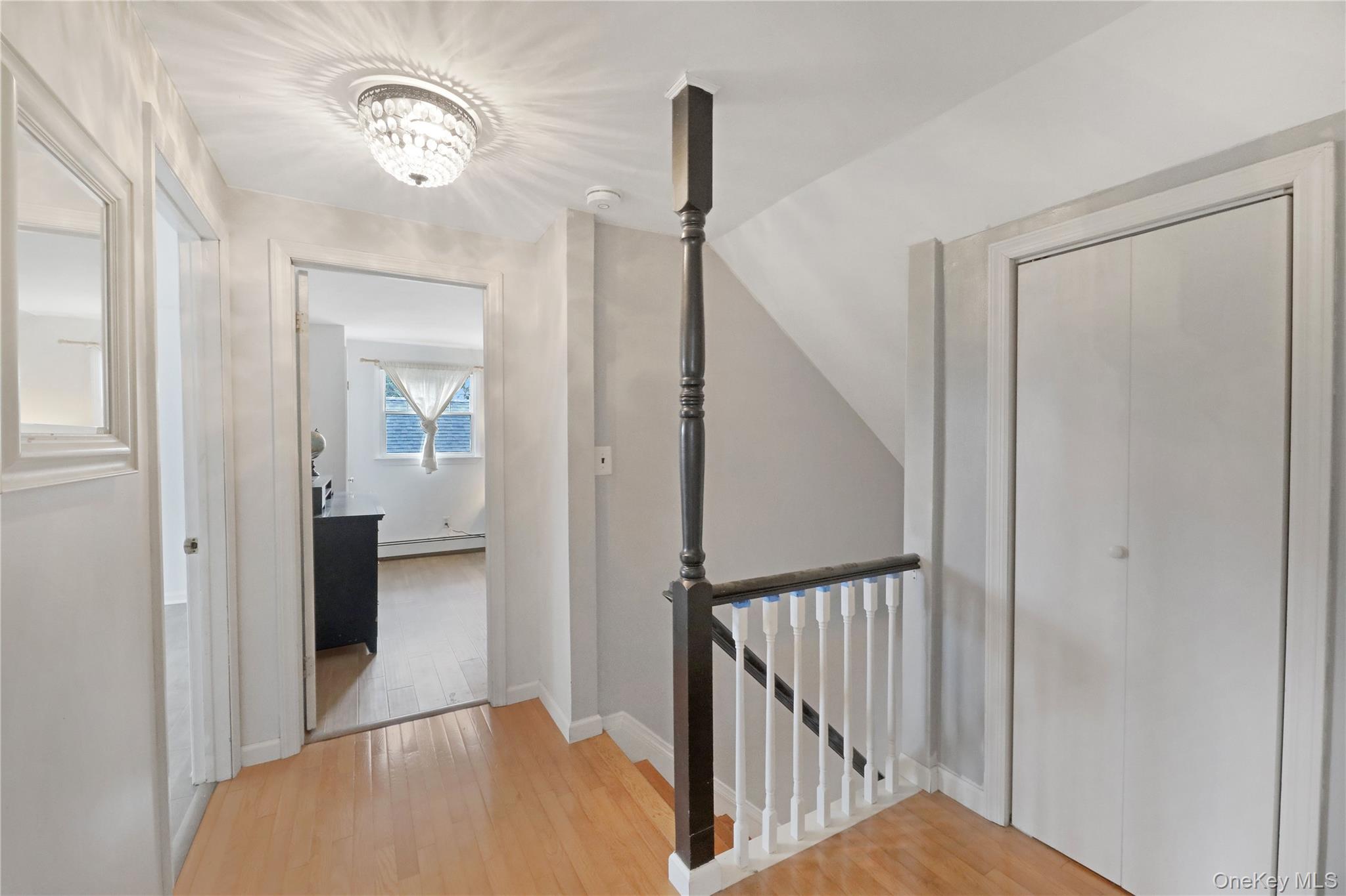 48 Nidzyn Avenue Remsenburg, NY 11960 - Photo 32 of 43 a view of a hallway with windows and stairs