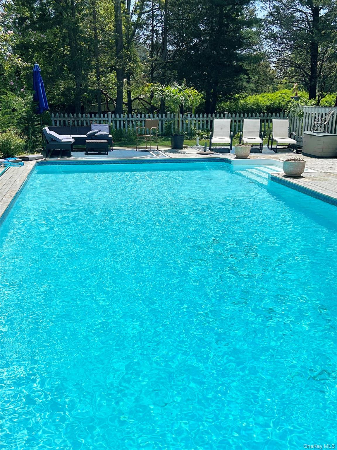 48 Nidzyn Avenue Remsenburg, NY 11960 - Photo 40 of 43 a view of a garden with sitting area