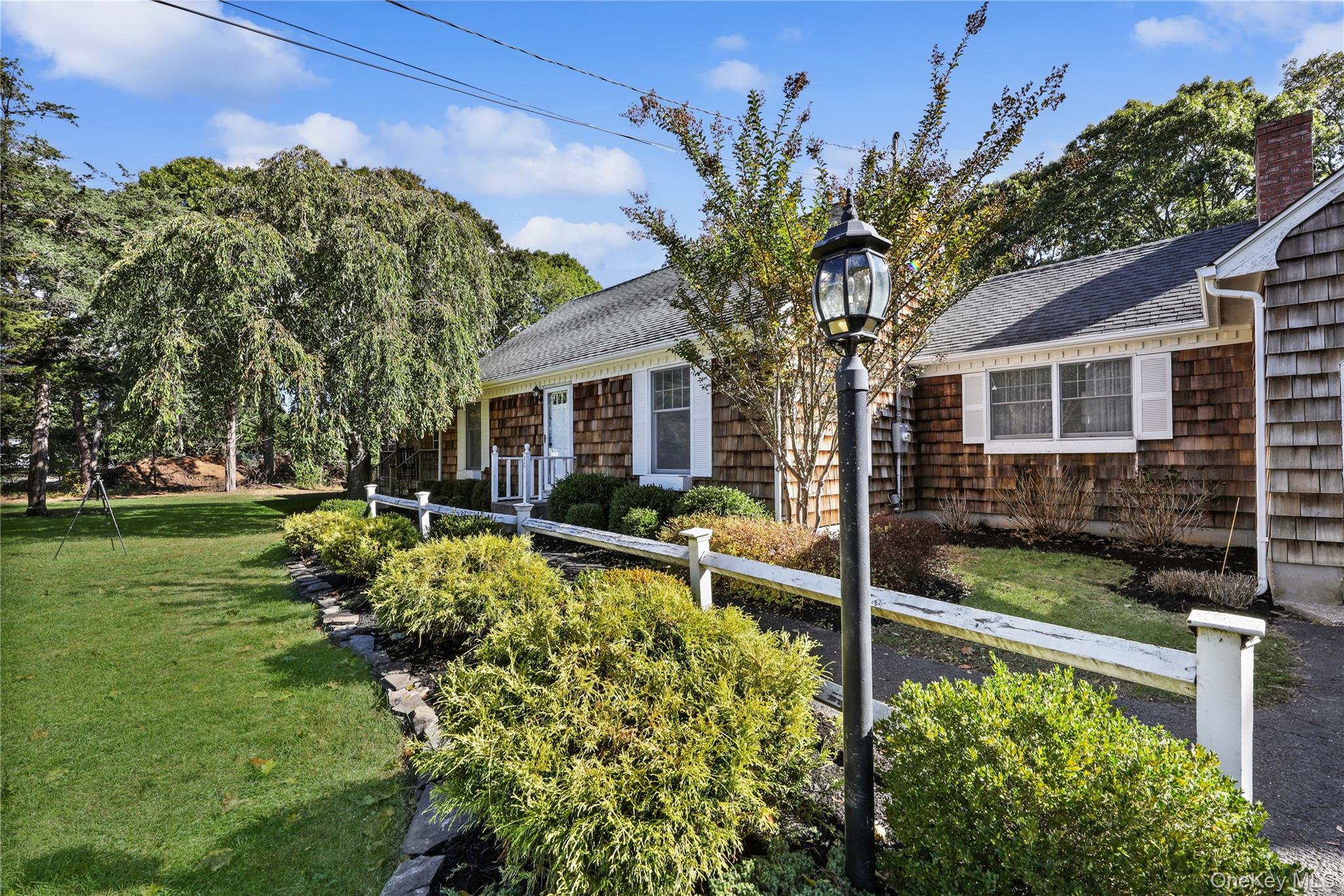 48 Nidzyn Avenue Remsenburg, NY 11960 - Photo 5 of 43 a view of a house with backyard and sitting area