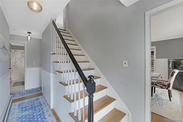 a view of an entryway with wooden floor