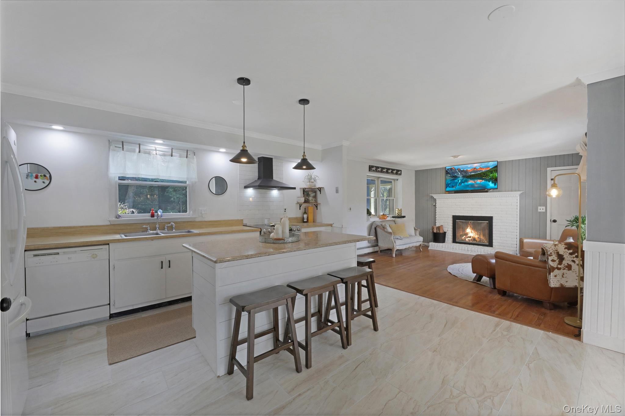 48 Nidzyn Avenue Remsenburg, NY 11960 - Photo 9 of 43 a kitchen with center island table and chairs