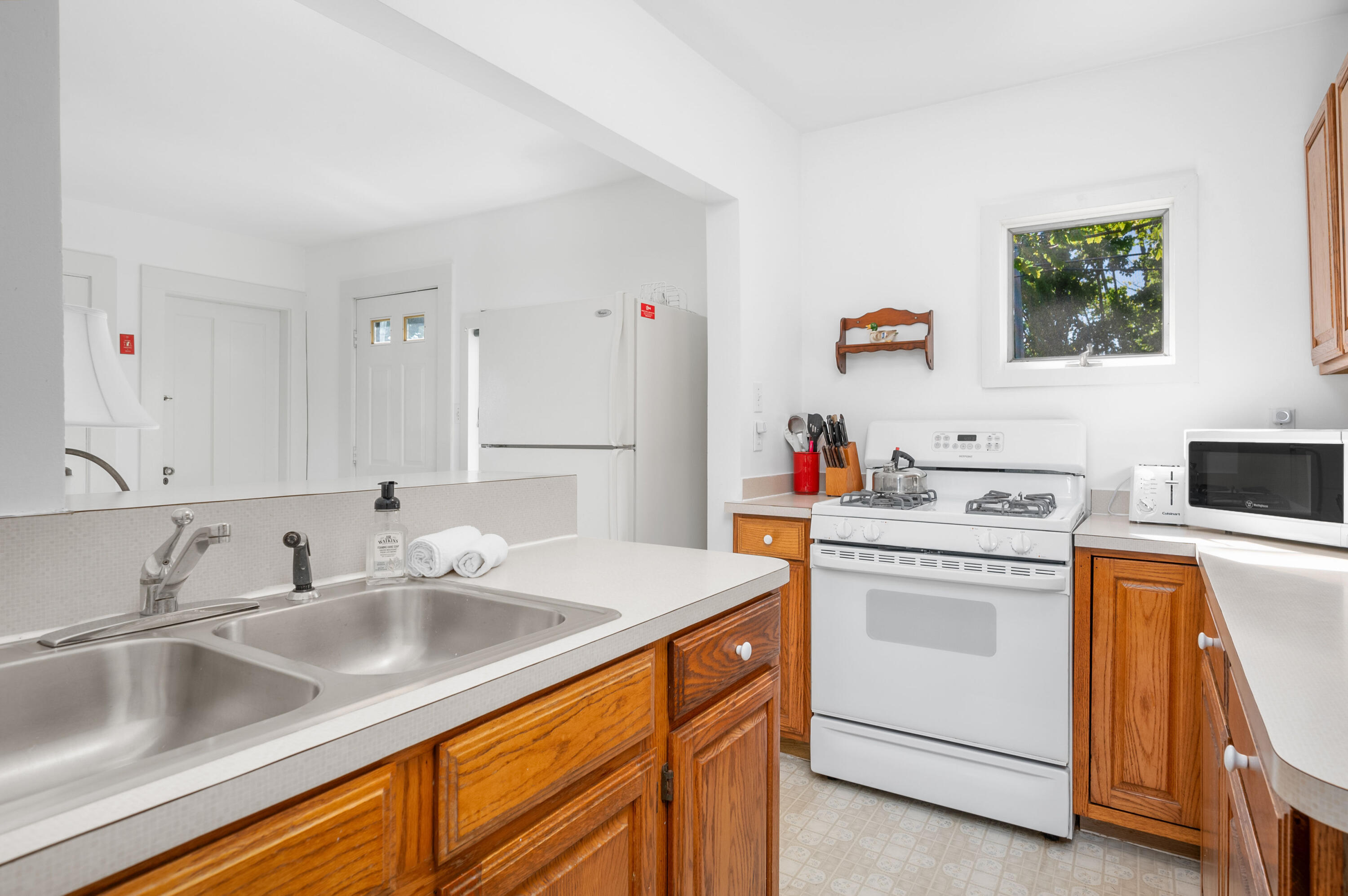 150 State Highway Eastham, MA 02642 - Photo 11 of 45 a kitchen that has a sink and a stove in it