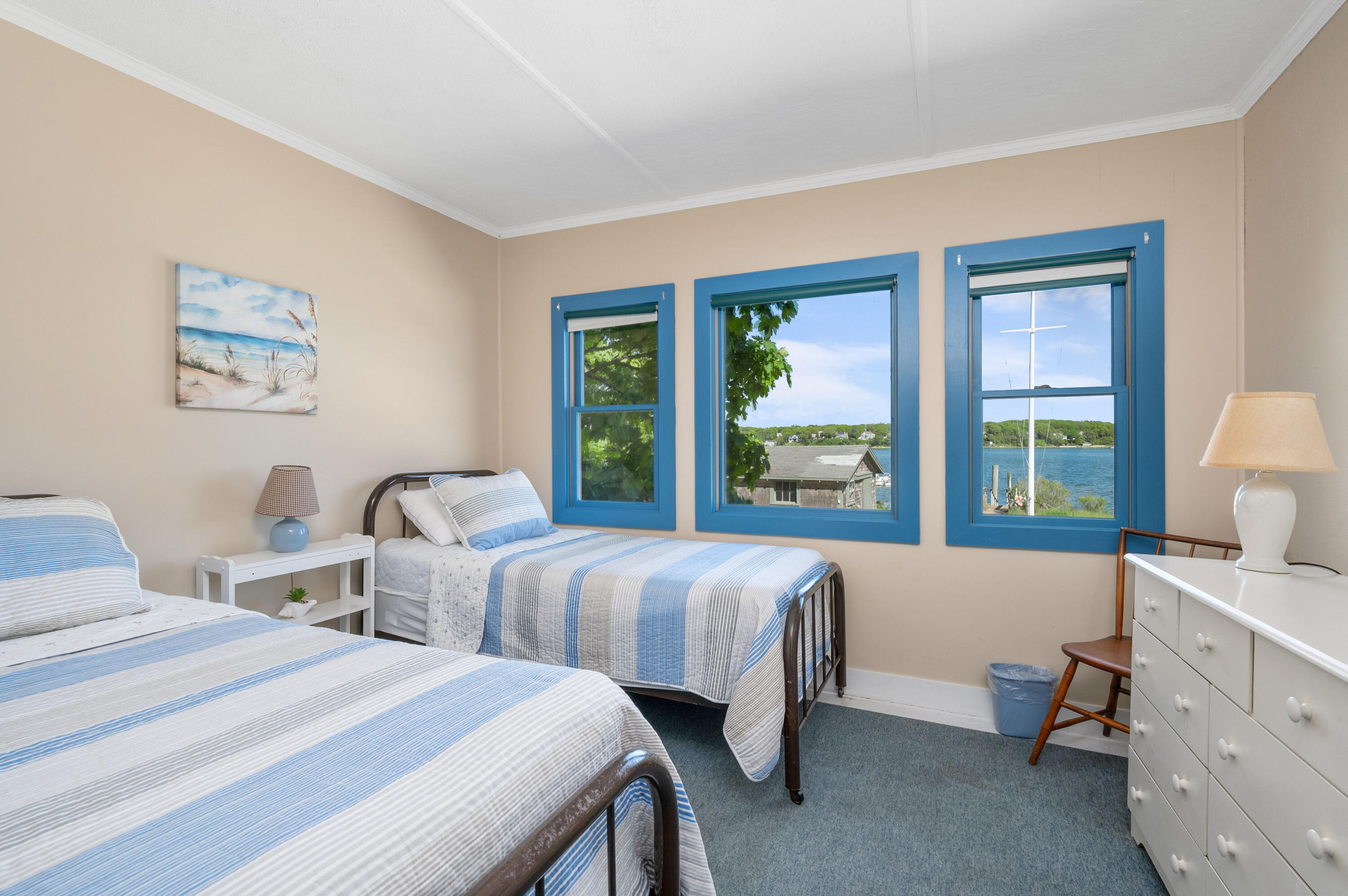 150 State Highway Eastham, MA 02642 - Photo 12 of 45 a bedroom with two beds and a large window