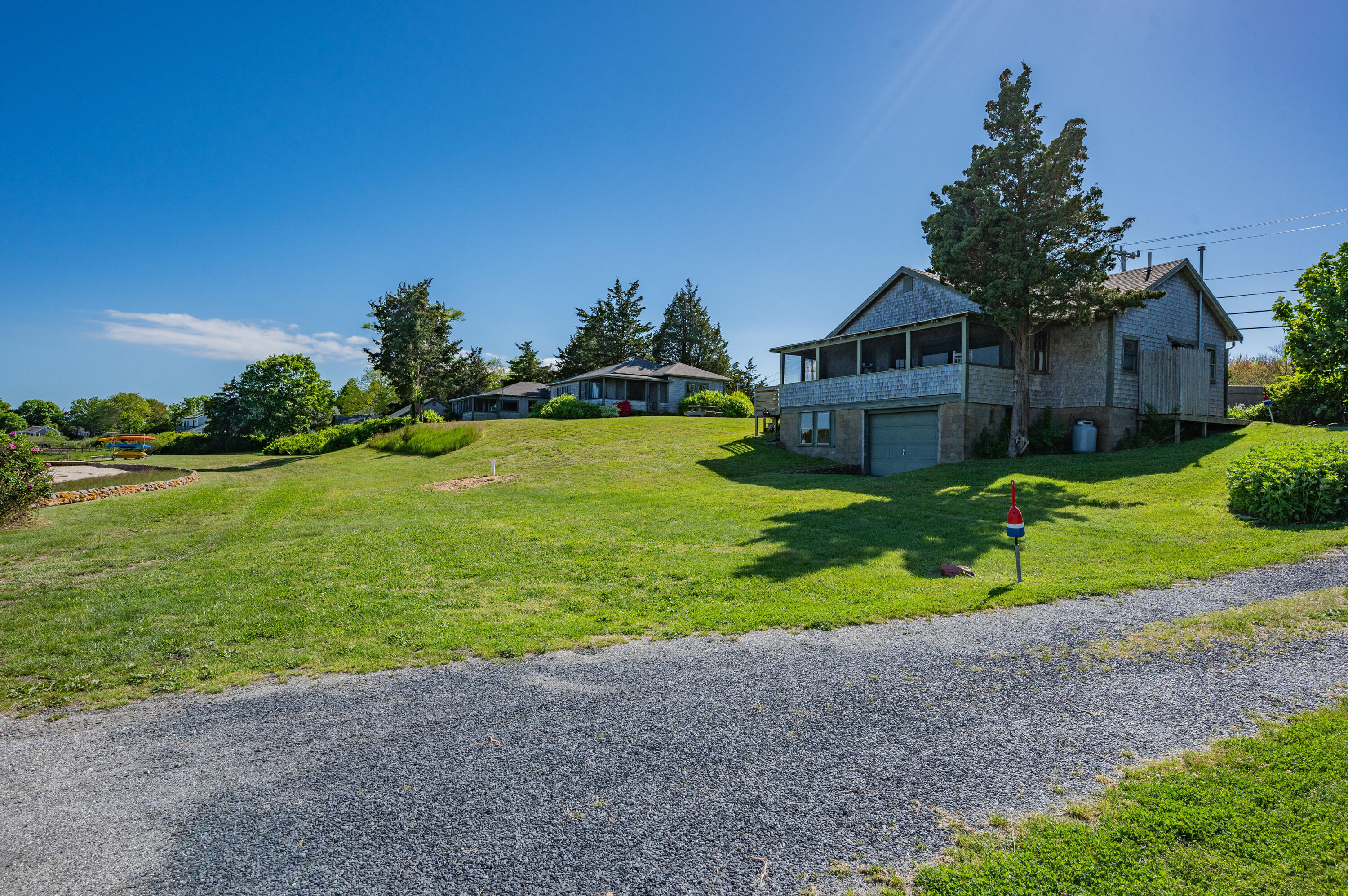 150 State Highway Eastham, MA 02642 - Photo 18 of 45 a front view of a house with garden