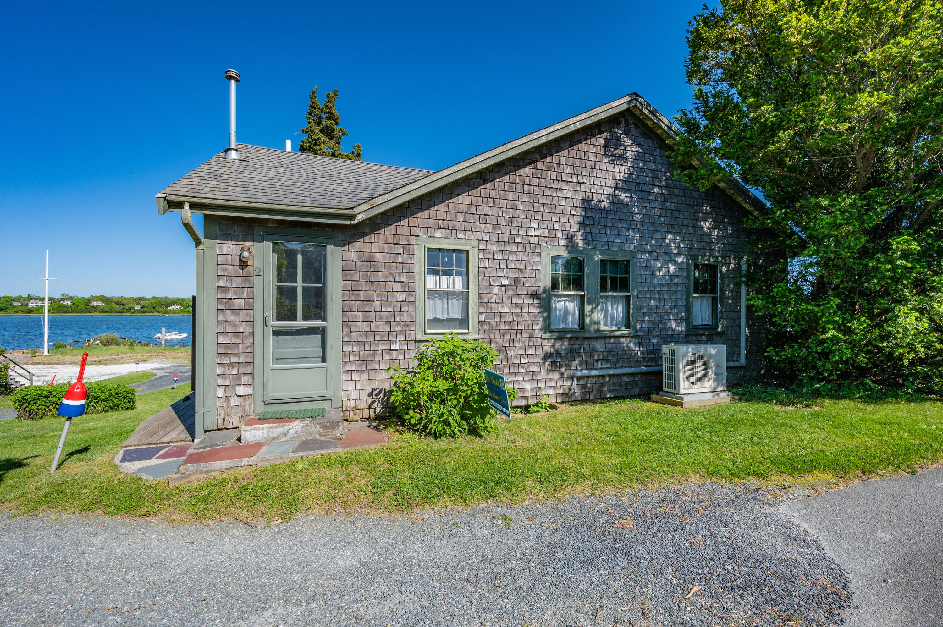 150 State Highway Eastham, MA 02642 - Photo 20 of 45 a front view of a house with garden