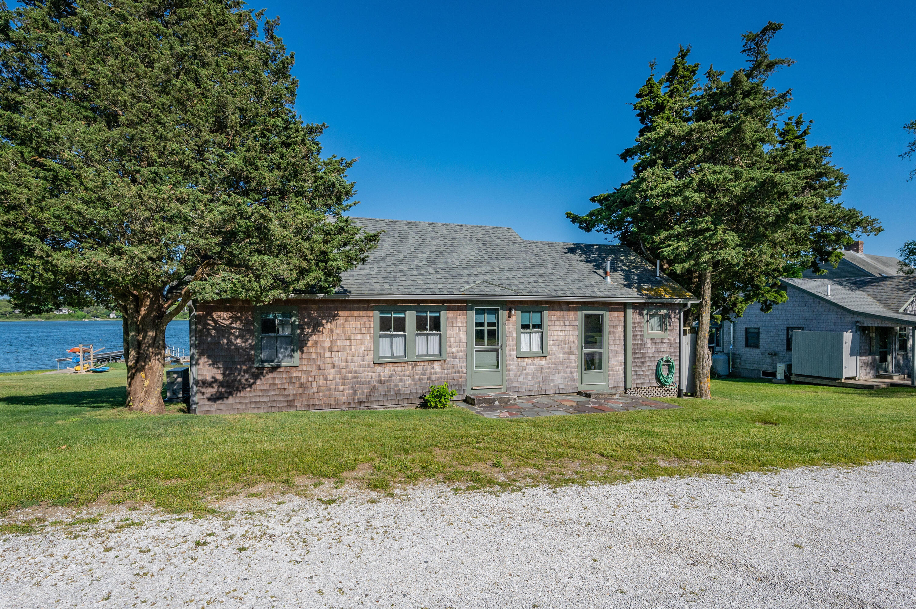 150 State Highway Eastham, MA 02642 - Photo 29 of 45 a front view of house with yard and green space