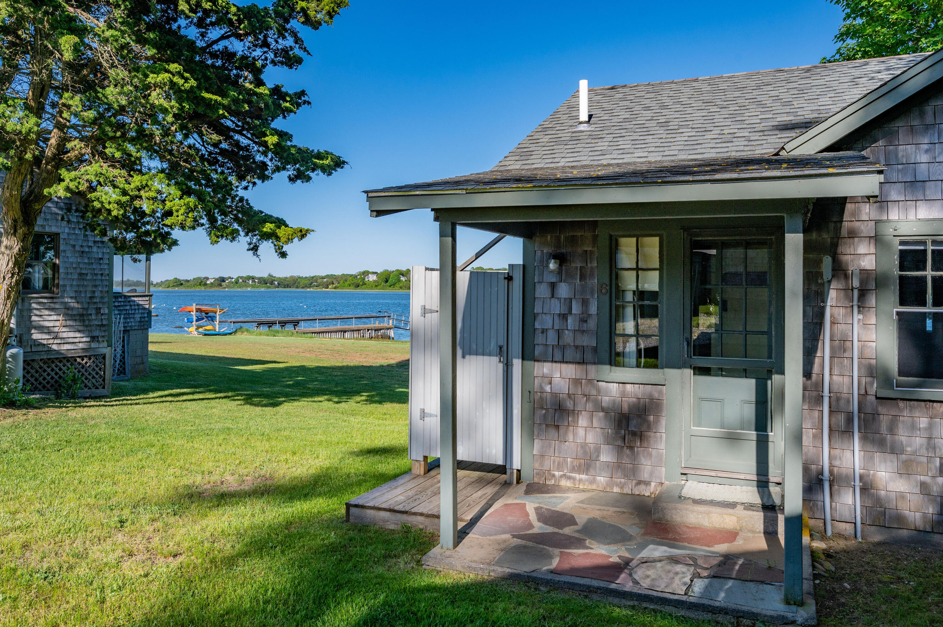150 State Highway Eastham, MA 02642 - Photo 34 of 45 a front view of a house with garden