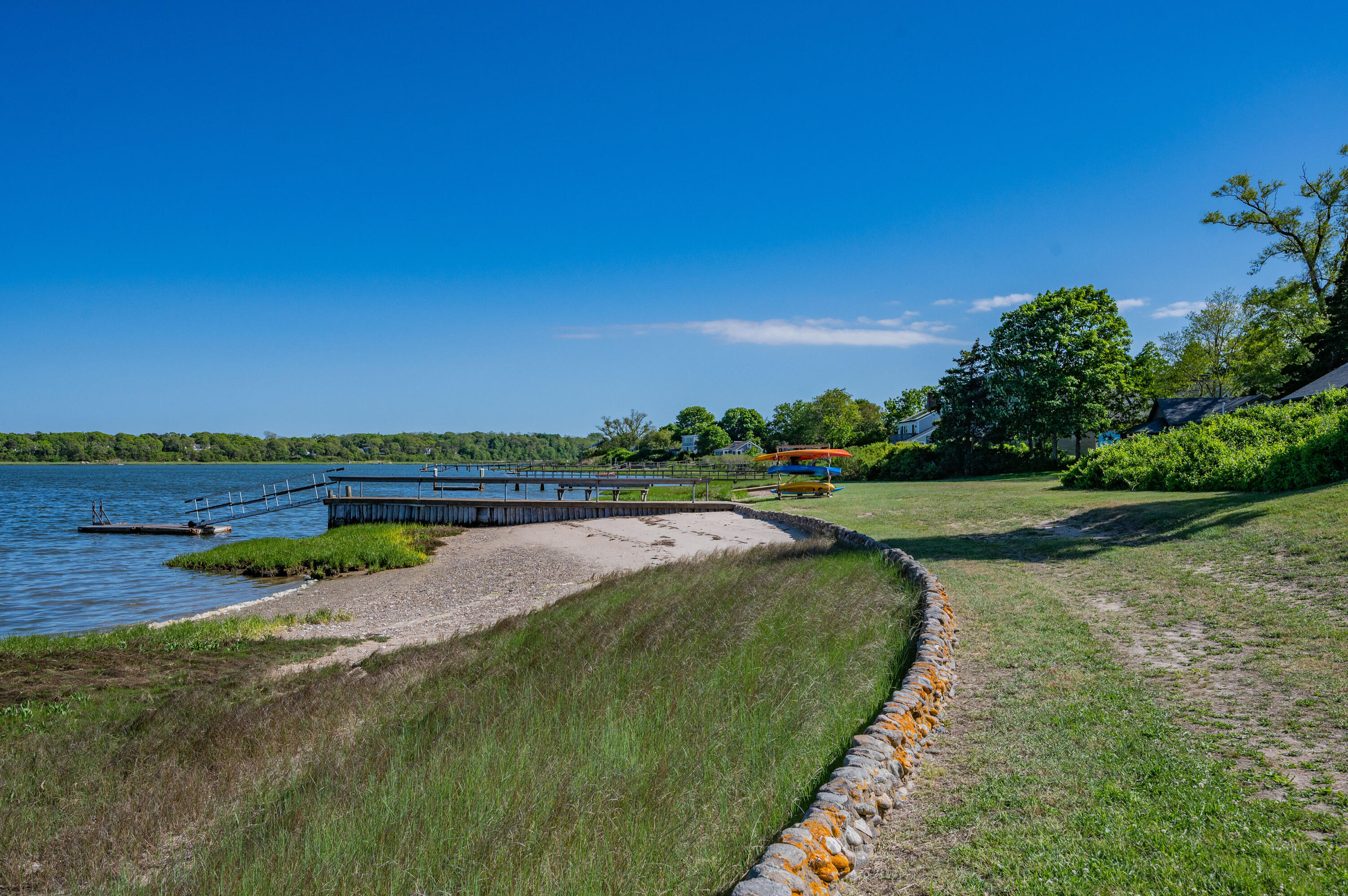 150 State Highway Eastham, MA 02642 - Photo 44 of 45 a view of a lake with a building in the background