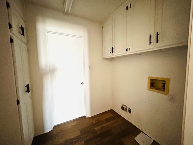 a spacious bathroom with a granite countertop sink mirror and bathtub