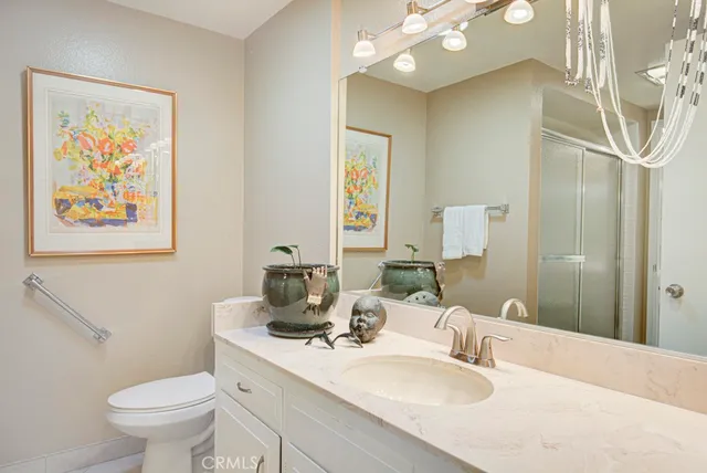 a bathroom with a glass shower door