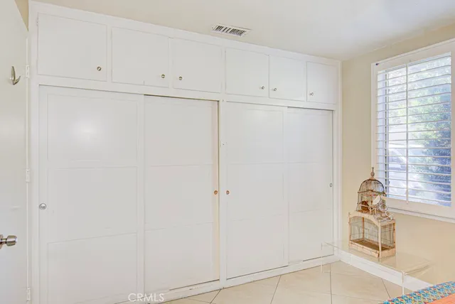 a view of a storage and utility room with cabinet
