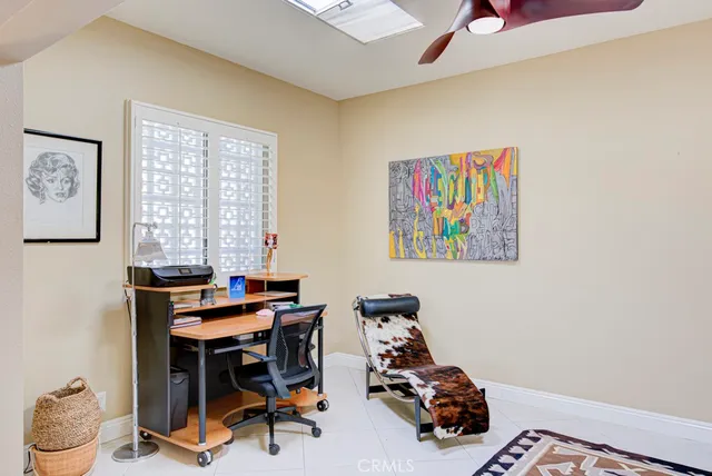 a living room with furniture and white walls