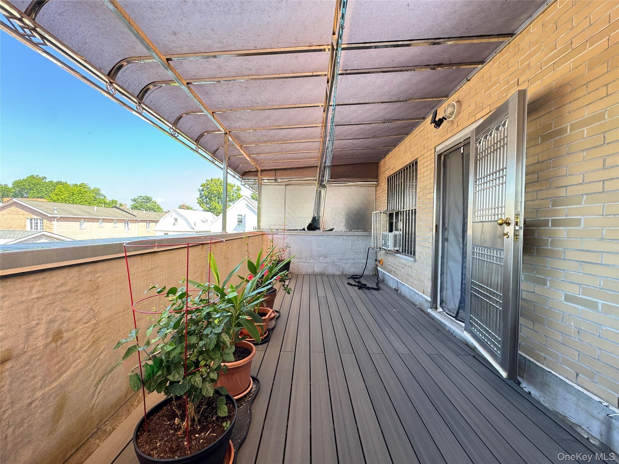 42-16 162nd Street Queens, NY 11358 - Photo 10 of 16 View of wooden deck