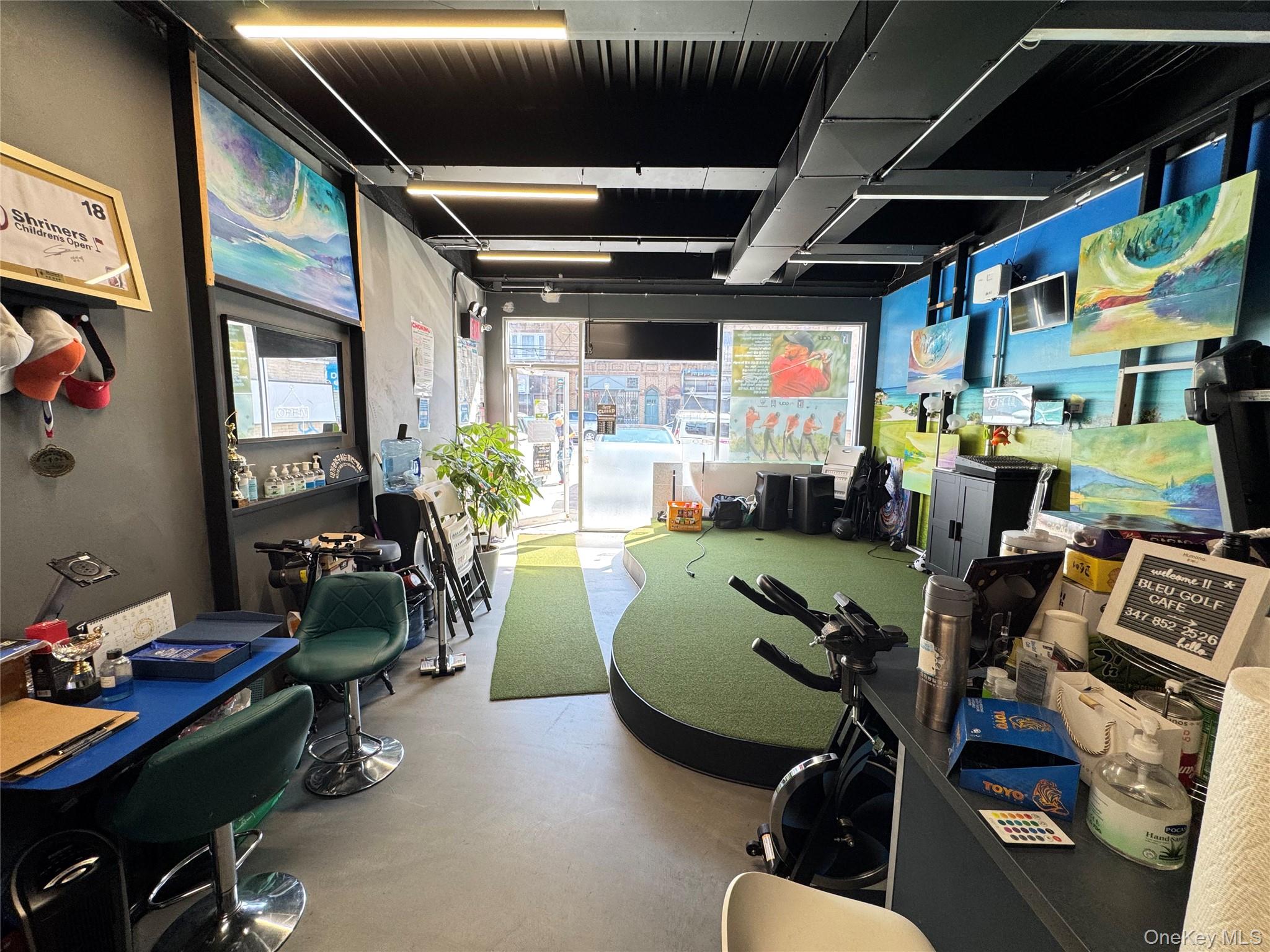 42-16 162nd Street Queens, NY 11358 - Photo 13 of 16 Recreation room featuring finished concrete floors and golf simulator