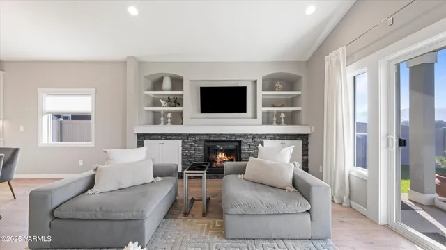 a living room with furniture and a fireplace