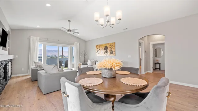 a spacious bedroom with a bed and a chandelier