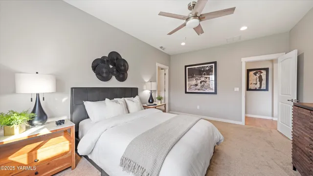a bathroom with a granite countertop sink a mirror and a shower