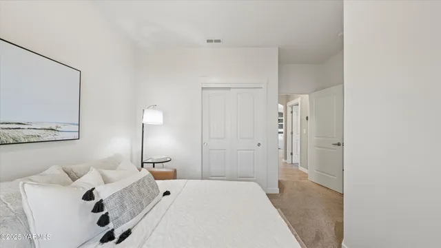 a bedroom with a bed and window