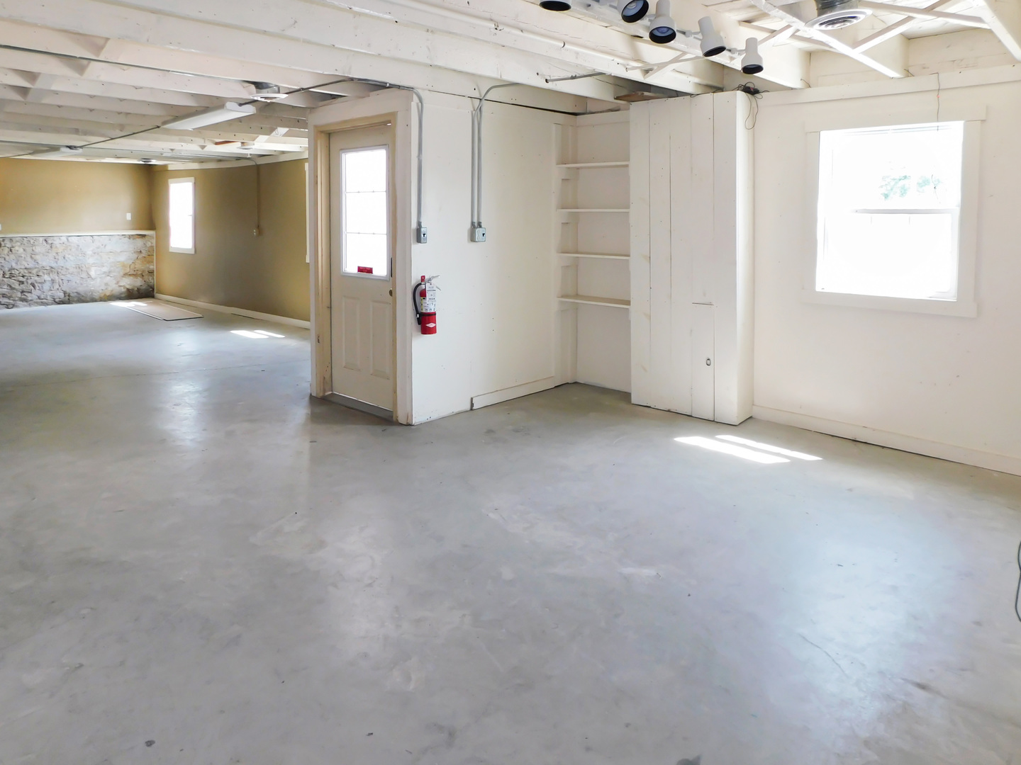 122 South Prairie Street, Unit 3 Rockton, IL 61072 - Photo 4 of 15 an empty room with windows and entrance