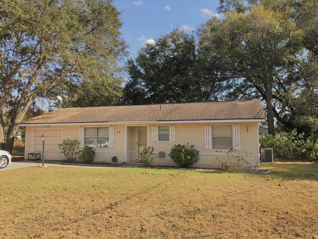 20 Teak Road Ocala, FL 34472 - Photo 1 of 1 front view of house with potted plants