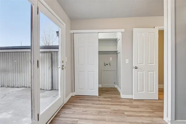 a view of a dining room with furniture and a window