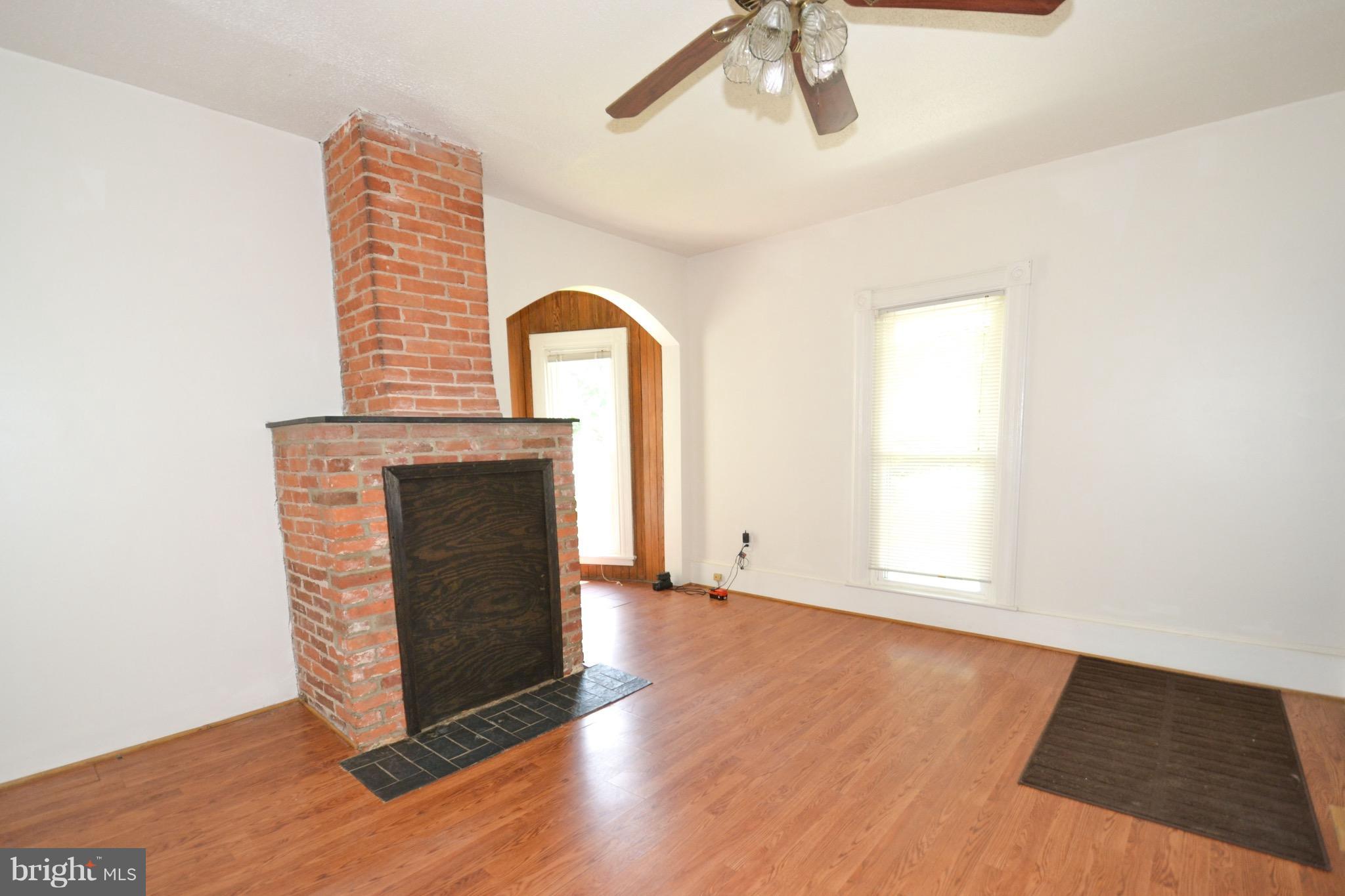 374 Jewell Road Dunkirk, MD 20754 - Photo 13 of 25 a view of an empty room with wooden floor and a fireplace