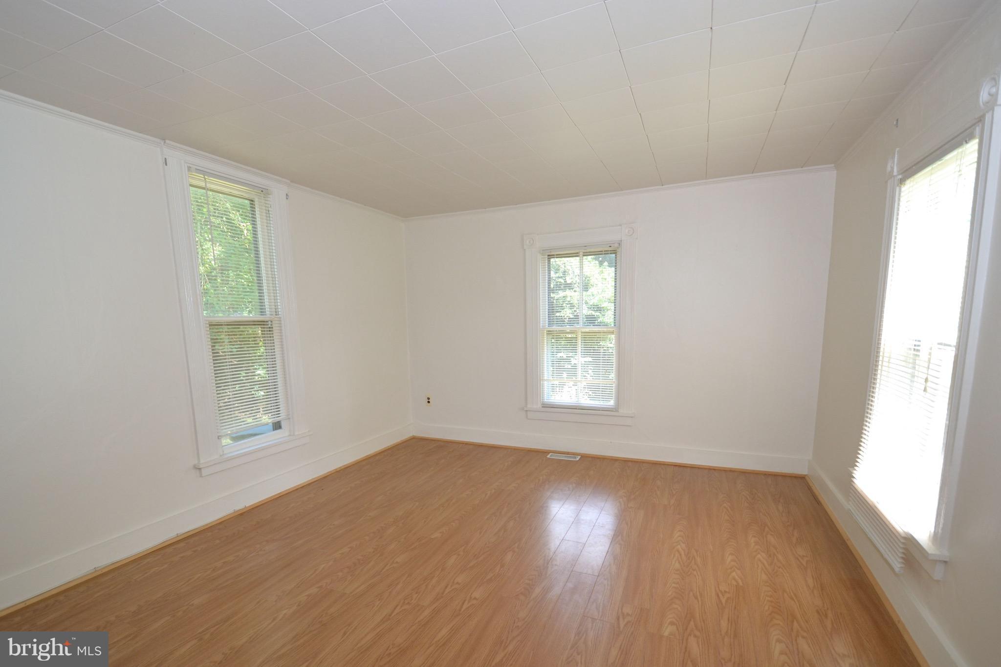 374 Jewell Road Dunkirk, MD 20754 - Photo 15 of 25 a view of a room that has wooden floor and window in it