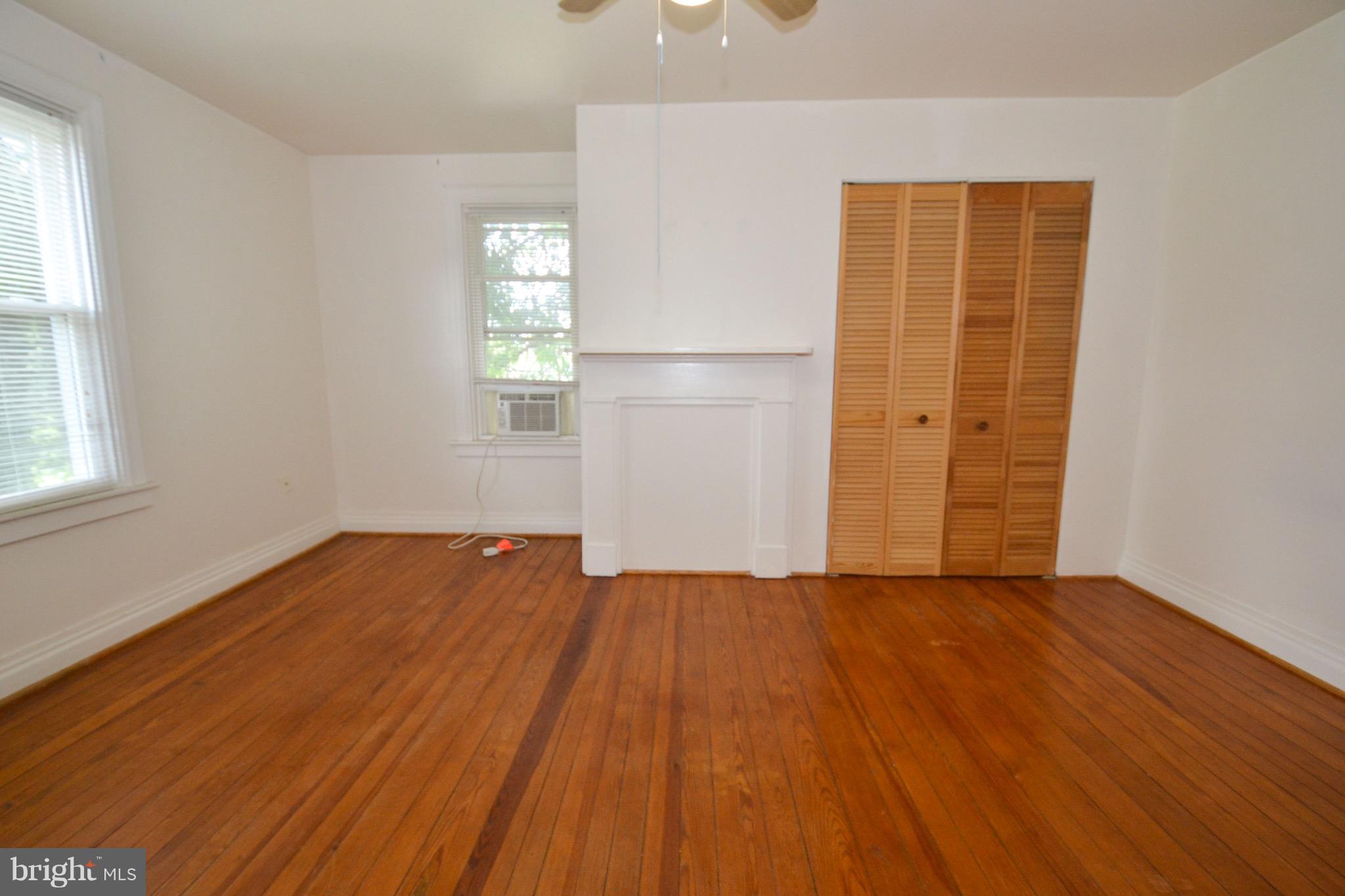 374 Jewell Road Dunkirk, MD 20754 - Photo 17 of 25 an empty room with wooden floor and windows