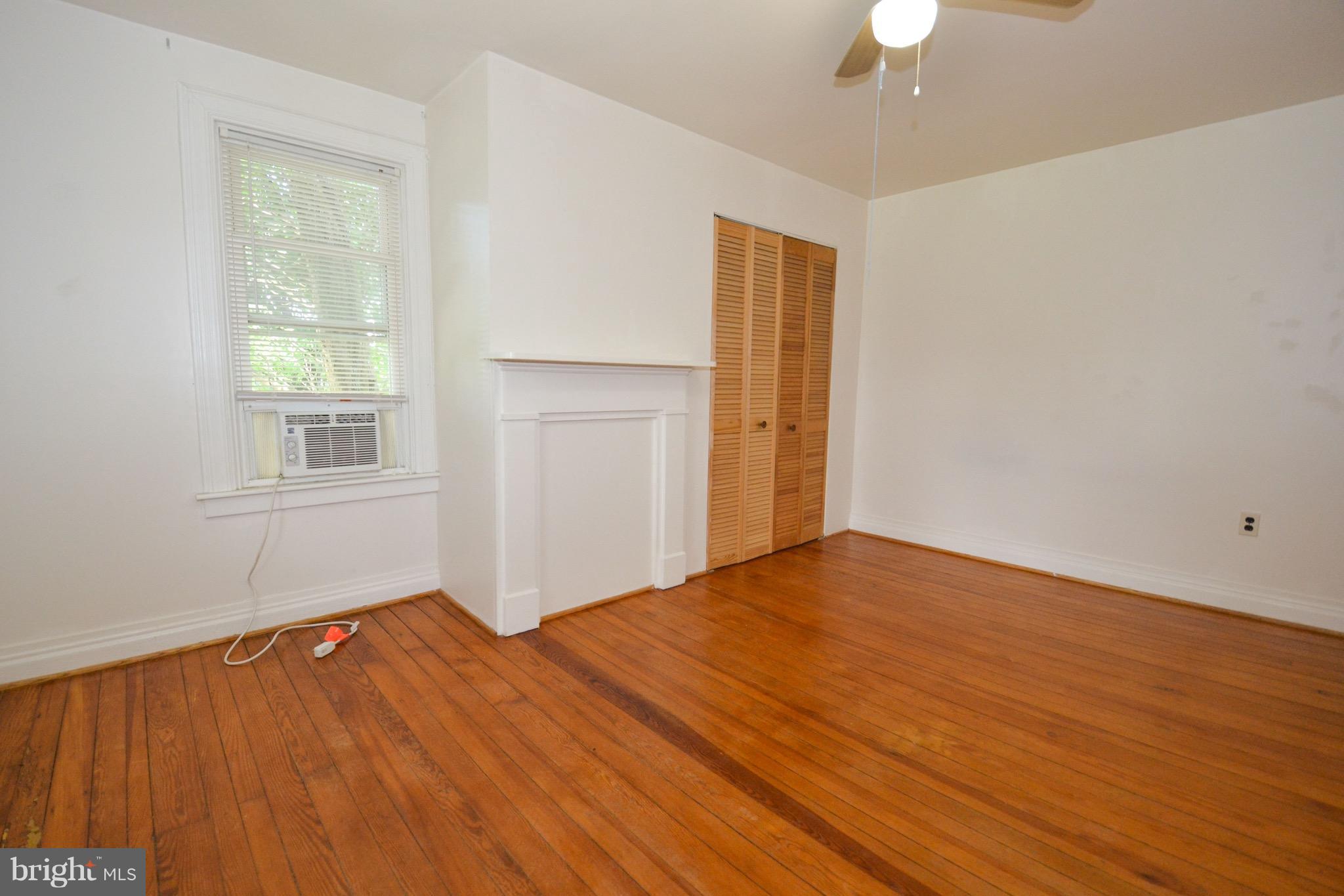 374 Jewell Road Dunkirk, MD 20754 - Photo 18 of 25 a view of empty room with wooden floor and fan