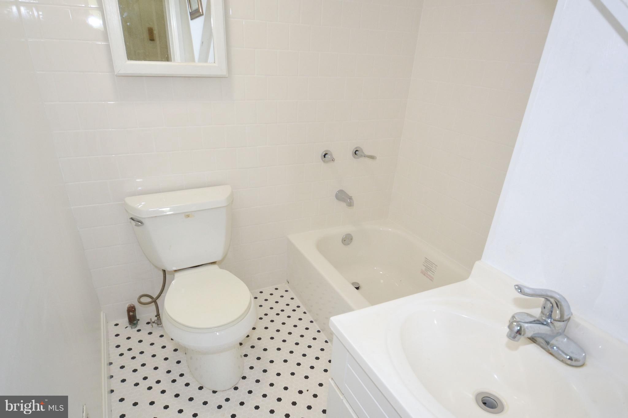 374 Jewell Road Dunkirk, MD 20754 - Photo 19 of 25 a white toilet sitting next to a bath tub