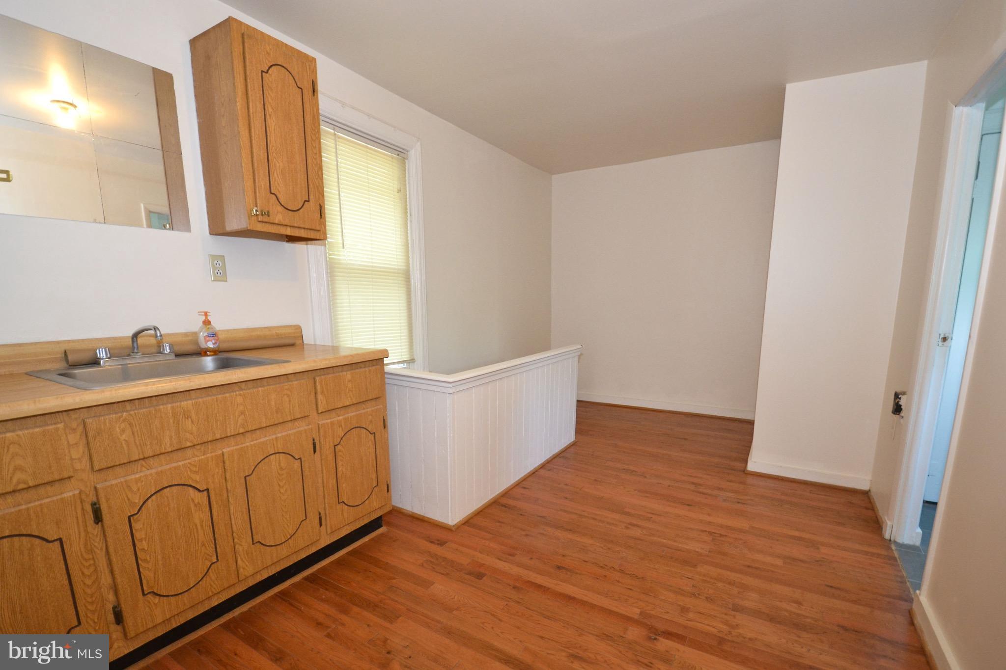 374 Jewell Road Dunkirk, MD 20754 - Photo 24 of 25 a kitchen with granite countertop white cabinets and sink