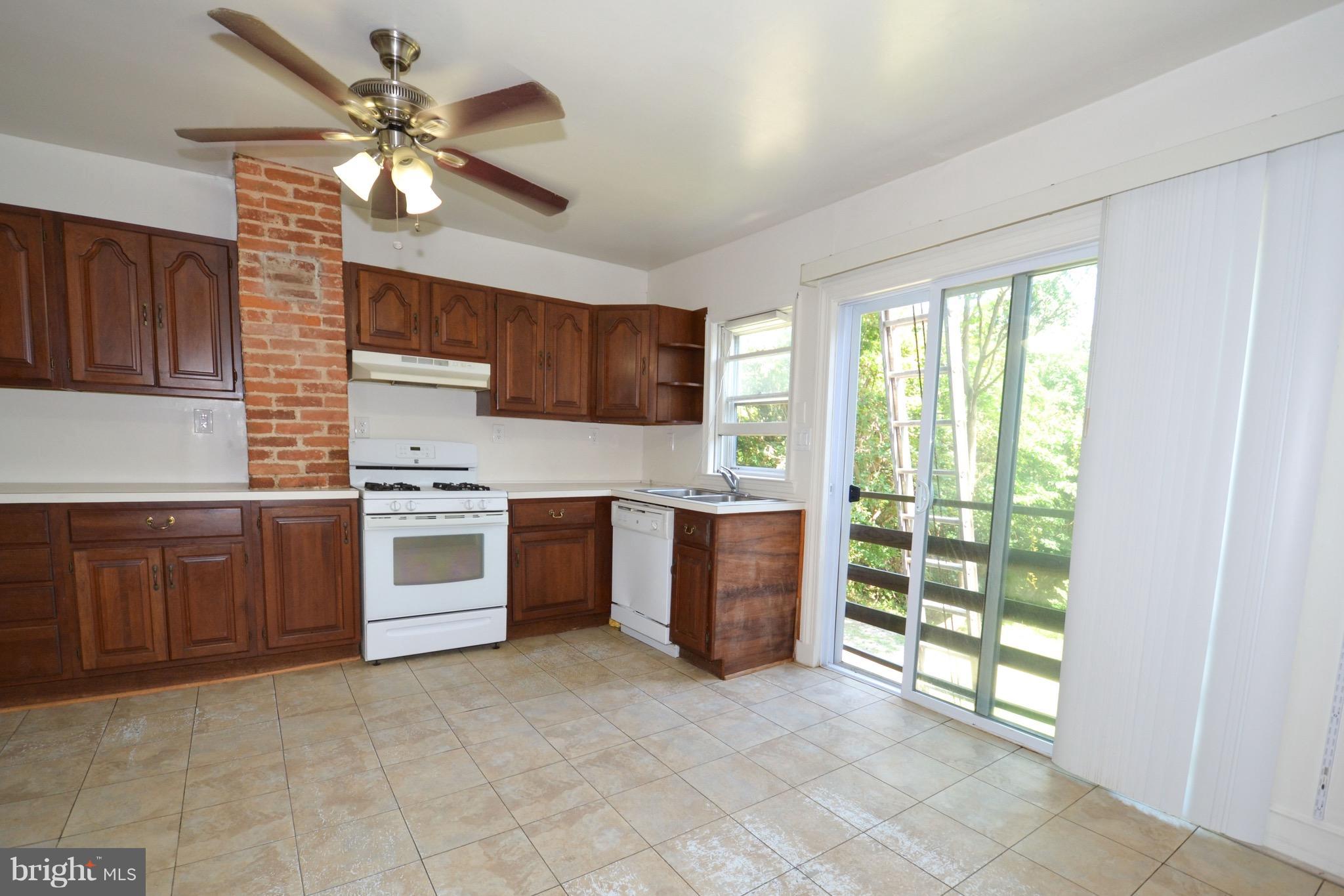 374 Jewell Road Dunkirk, MD 20754 - Photo 9 of 25 a kitchen with stainless steel appliances granite countertop a stove sink and microwave