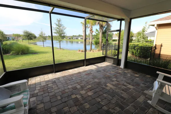 a view of an empty room and floor to ceiling window