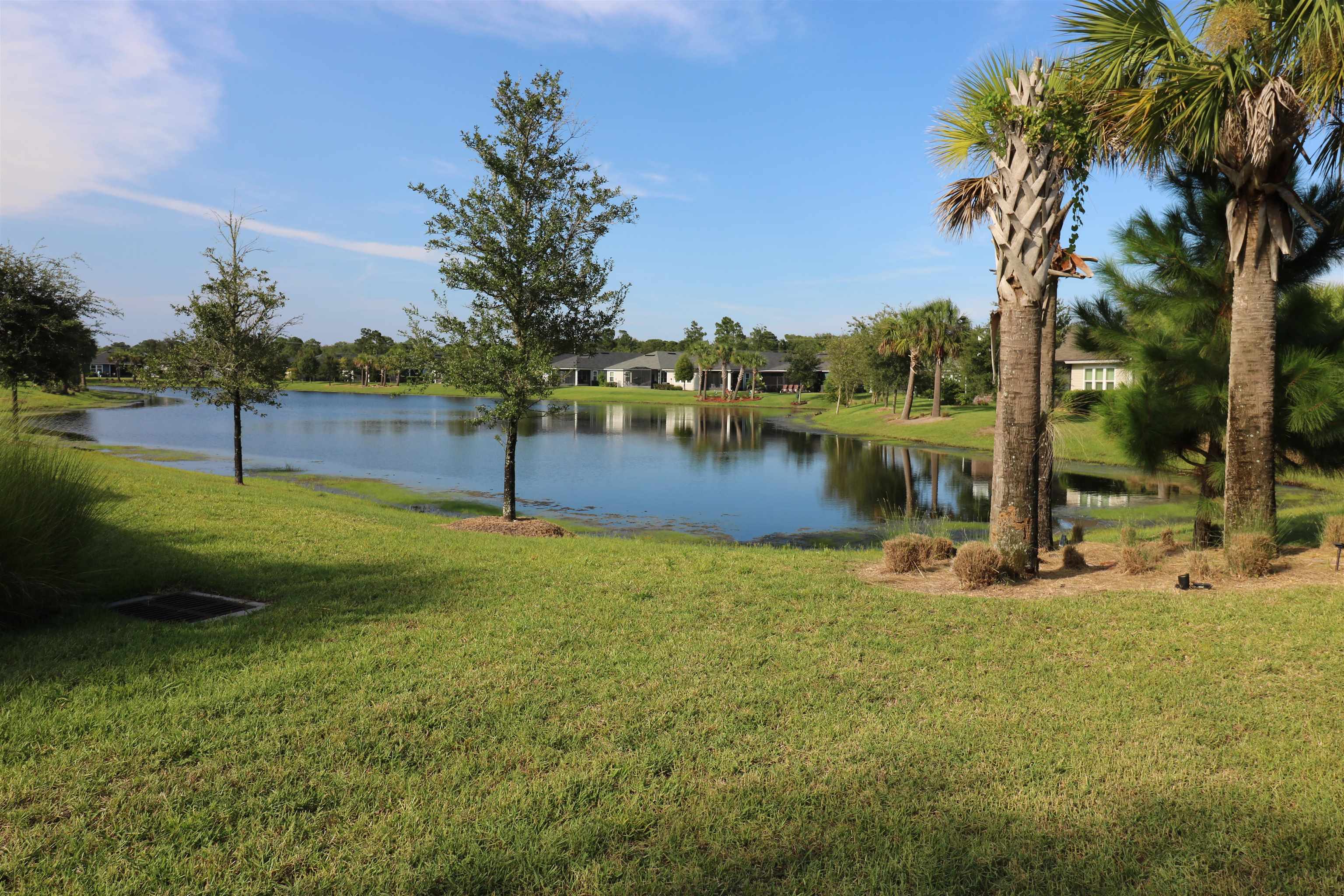 827 East Watson Road St. Augustine, FL 32086 - Photo 13 of 26 a view of a lake with a yard