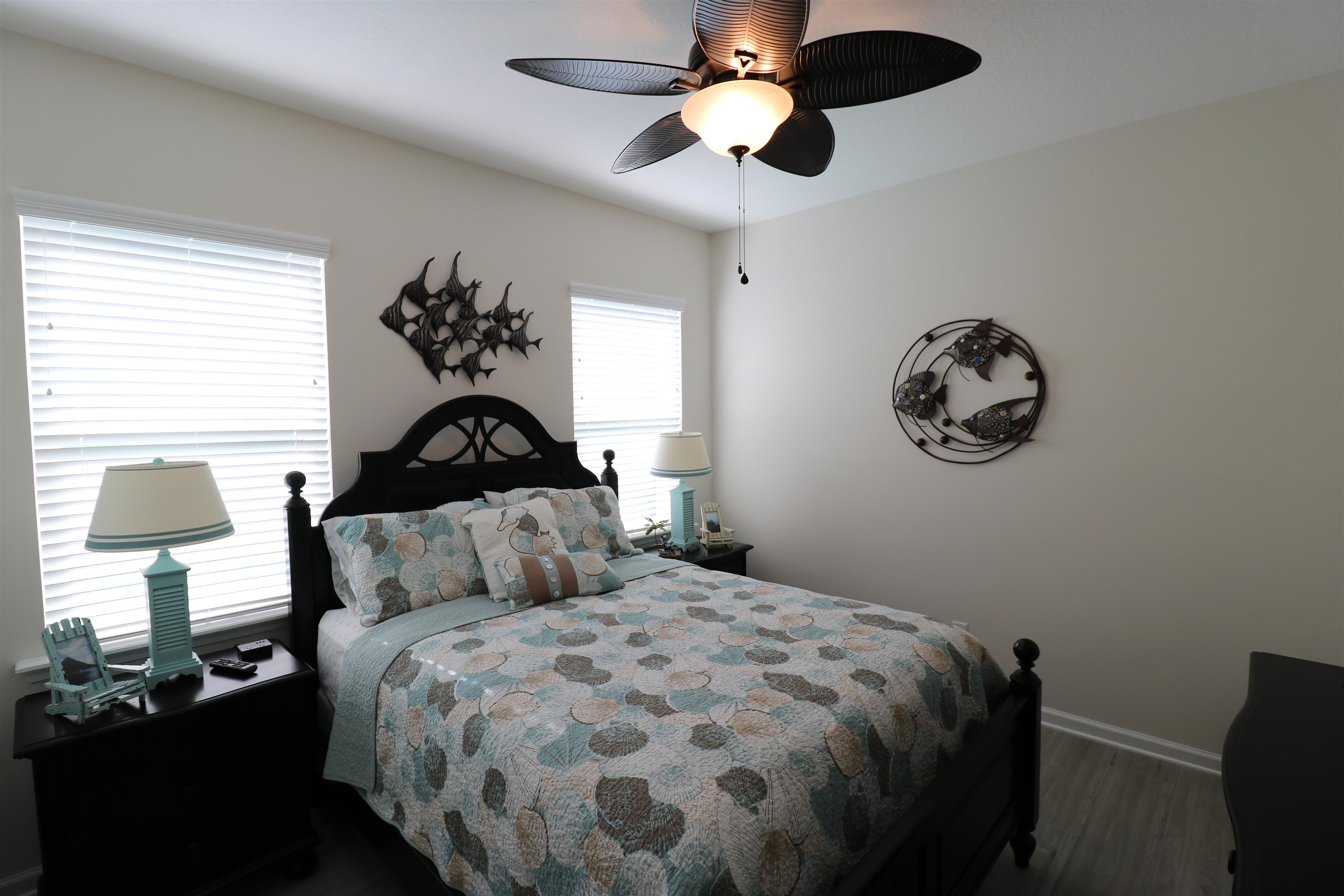 827 East Watson Road St. Augustine, FL 32086 - Photo 18 of 26 a bedroom with a bed and a lamp
