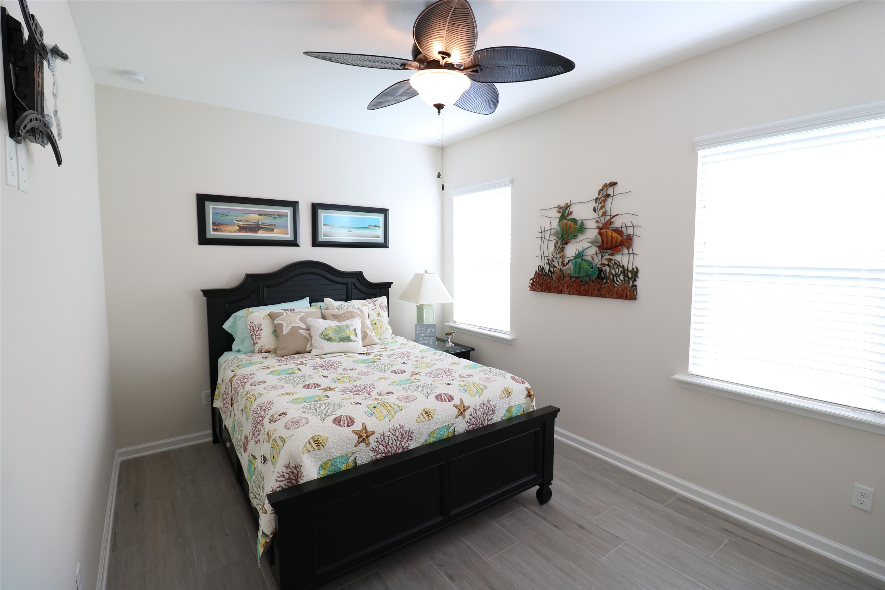 827 East Watson Road St. Augustine, FL 32086 - Photo 20 of 26 a bedroom with a bed and a chandelier
