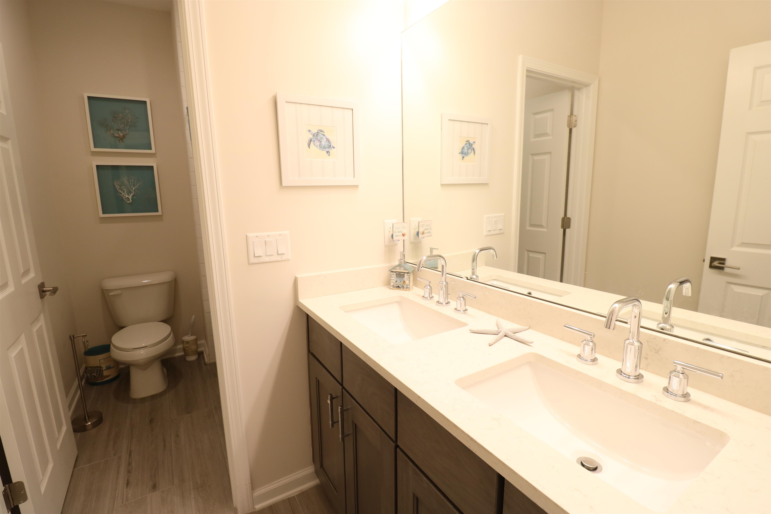 827 East Watson Road St. Augustine, FL 32086 - Photo 22 of 26 a bathroom with a sink toilet and a mirror