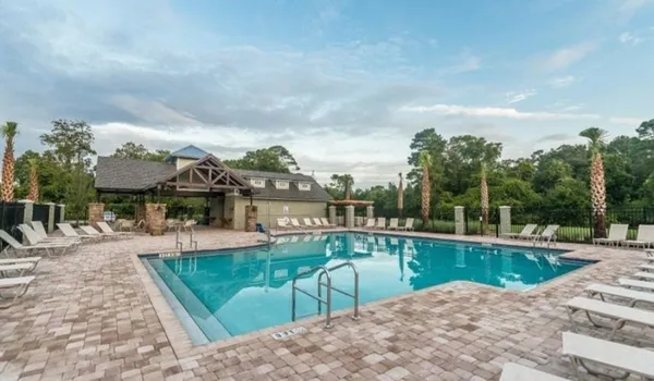 a view of a swimming pool with a patio