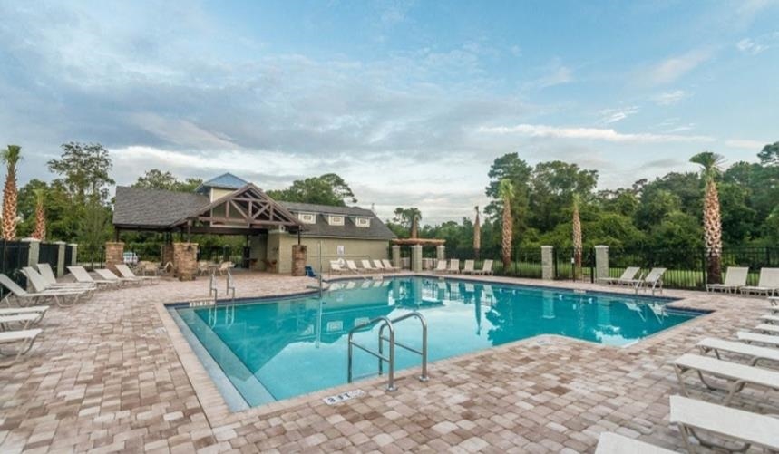827 East Watson Road St. Augustine, FL 32086 - Photo 25 of 26 a view of a swimming pool with a patio