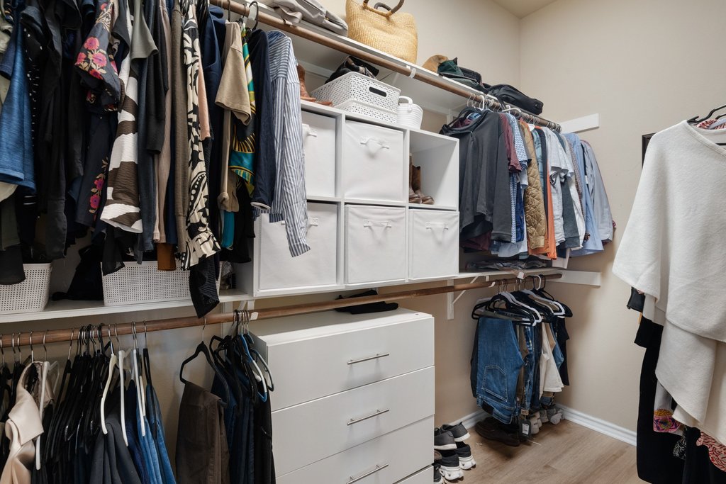 322 River Bluff Circle Georgetown, TX 78626 - Photo 22 of 35 a view of walk in closet with clothes and shoes