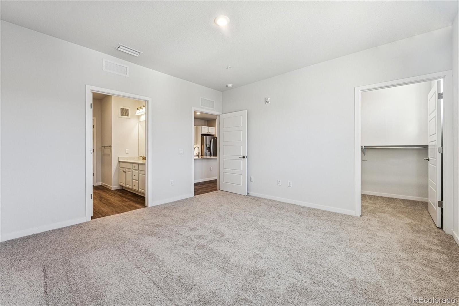 485 Interlocken Boulevard, Unit 210 Broomfield, CO 80021 - Photo 13 of 15 a view of an empty room with closet and entryway