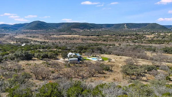 a view of a town with mountains in the background