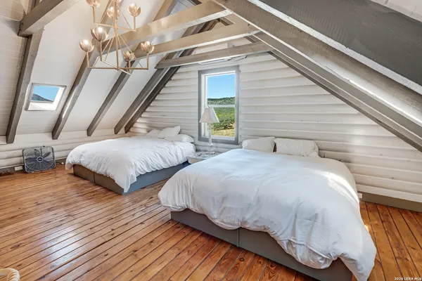 a bedroom with a bed and window